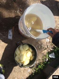 In Lesbos’ last known ‘free’ camp, where people can come or go as they please, residents say there is very little to eat, and boiled potatoes are their main source of nutrition in Lesbos, Greece, April 4, 2016. (H. Murdock/VOA)
