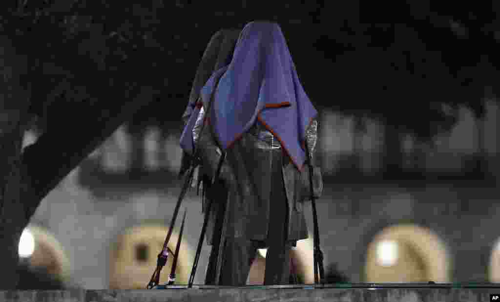 Confederate statutes removed from the University of Texas are secured to a trailer, in Austin, Texas. University of Texas President Greg Fenves ordered the immediate removal of statues of Robert E. Lee and other prominent Confederate figures from a main area of campus Sunday night, saying such monuments have become &quot;symbols of modern white supremacy and neo-Nazism.&quot;