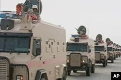 Saudi Arabian troops cross the causeway leading to Bahrain in this still image taken from video, March 14, 2011.