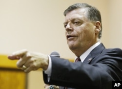 FILE - U.S. Rep. Tom Cole, R-Okla., shown at a town hall meeting in Moore, Okla., in August 2015, said Donald Trump's second-place finish to Ted Cruz in the Iowa caucuses had erased the billionaire candidate's aura of inevitability.