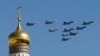 FILE - Russian military planes fly above the Kremlin.