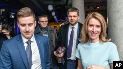 From the left: Reform party Party's secretary-general Erkki Keldo, Sven Mikser from Social Democrates, Jevgeni Ossinovski, leader of Social Democrates and Kaja Kallas pose for a photo after parliamentary elections in Tallinn, Estonia, early March 4, 2019.