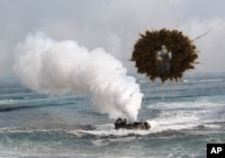 FILE - A South Korean marine LVT-7 landing craft sailing through a smoke screen during joint U.S.-South Korean exercises.