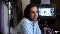 An undated photo provided by Iranian filmmaker Keywan Karimi, shows Karimi during work on a scene in the movie "Drum", in Tehran early in 2016.