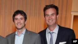 FILE - Jamie Erlicht, left, and Zack Van Amburg are pictured at a Showtime/Sony Pictures Television gathering in Culver City, Calif., July 16, 2014. 