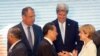 Russia's Foreign Minister Sergey Lavrov, U.S. Secretary of State John Kerry, rear, stand with India's Minister of External Foreign Affairs General V.K. Singh, left, China's Foreign Minister Wang Yi, center, and Australia's Foreign Minister Julie Bishop as