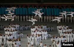 Performers show martial art moves during "The Glorious Country" mass games at May Day Stadium in Pyongyang, North Korea, Oct. 25, 2018.