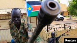 The state of Western Bahr el Ghazal has launched a recruitment drive to get young men and women to sign up and fight alongside SPLA forces like the two soldiers shown here in the flashpoint town of Malakal in Upper Nile state.
