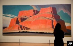 Maynard Dixon's 1935 painting "Red Butte with Mountain Men" is displayed in the exhibit "Cross Country: The Power of Place in American Art, 1915-1950," at the High Museum of Art in Atlanta, Feb. 6, 2017.