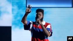 FILE - Khalid performs at the American Music Awards in Los Angeles, Nov. 19, 2017. Khalid is nominated for five Grammy Awards.