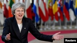 British Prime Minister Theresa May arrives at a European Union leaders summit in Brussels, Dec. 13, 2018. 