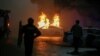 A police car burns during a protest following the Kazakh authorities' decision to lift price caps on liquefied petroleum gas in Almaty, Kazakhstan, Jan. 5, 2022. 