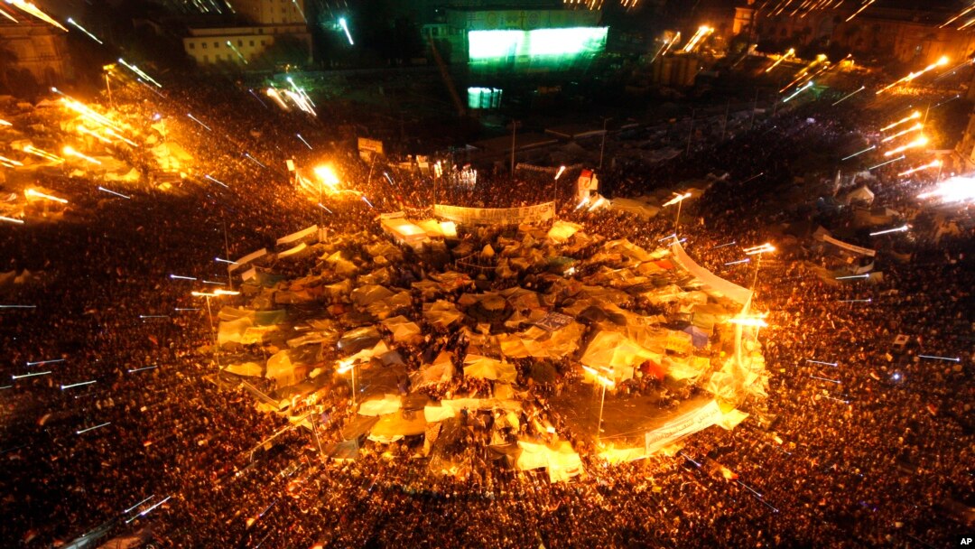 FILE - Egyptians celebrate after President Hosni Mubarak resigned and handed power to the military at Tahrir Square, Feb. 11, 2011.