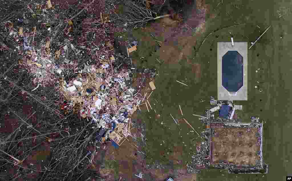 Debris from a home covers an outdoor area after a tornado blew it off the home's foundation, in Beauregard, Alabama.