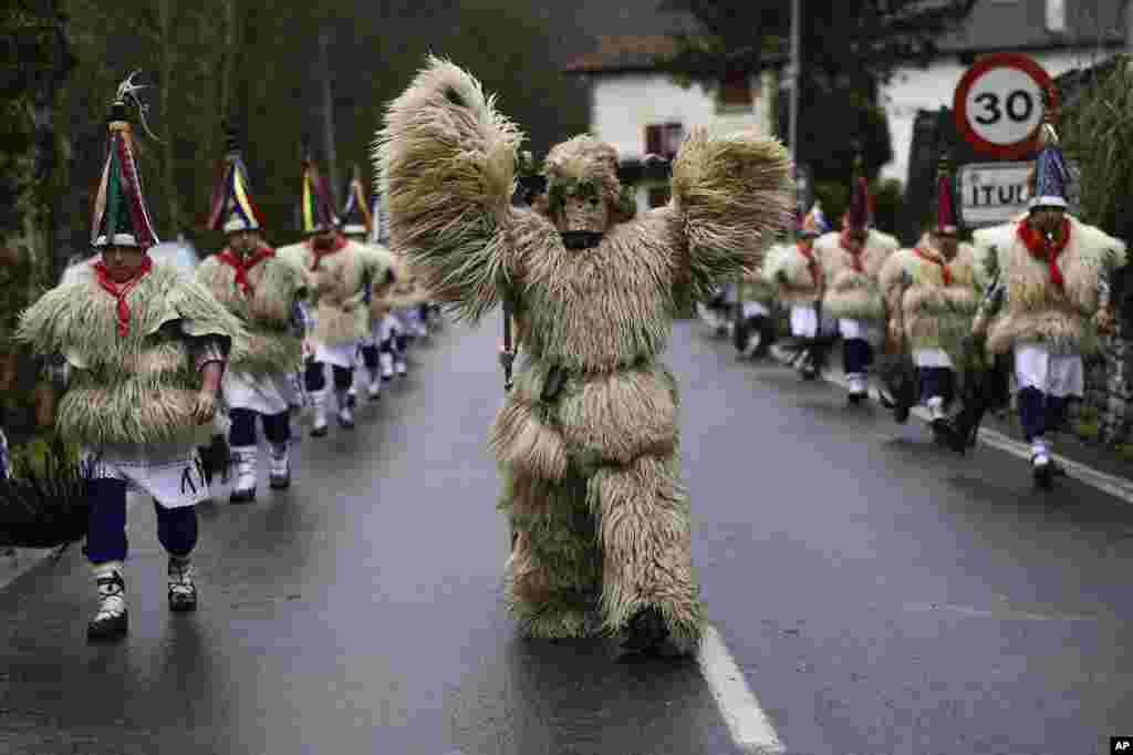 A group of Joaldunaks take part in the Carnival between the Pyrenees villages of Ituren and Zubieta, northern Spain, Jan. 31, 2022.