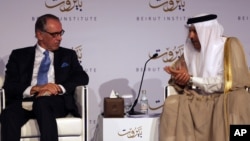 U.N. Deputy Secretary-General Jan Eliasson, left, listens to Abdullatif al-Zayani, Secretary General of the Gulf Cooperation Council, during the opening day of the Beirut Institute Summit, in Abu Dhabi, United Arab Emirates, Oct. 10, 2015.