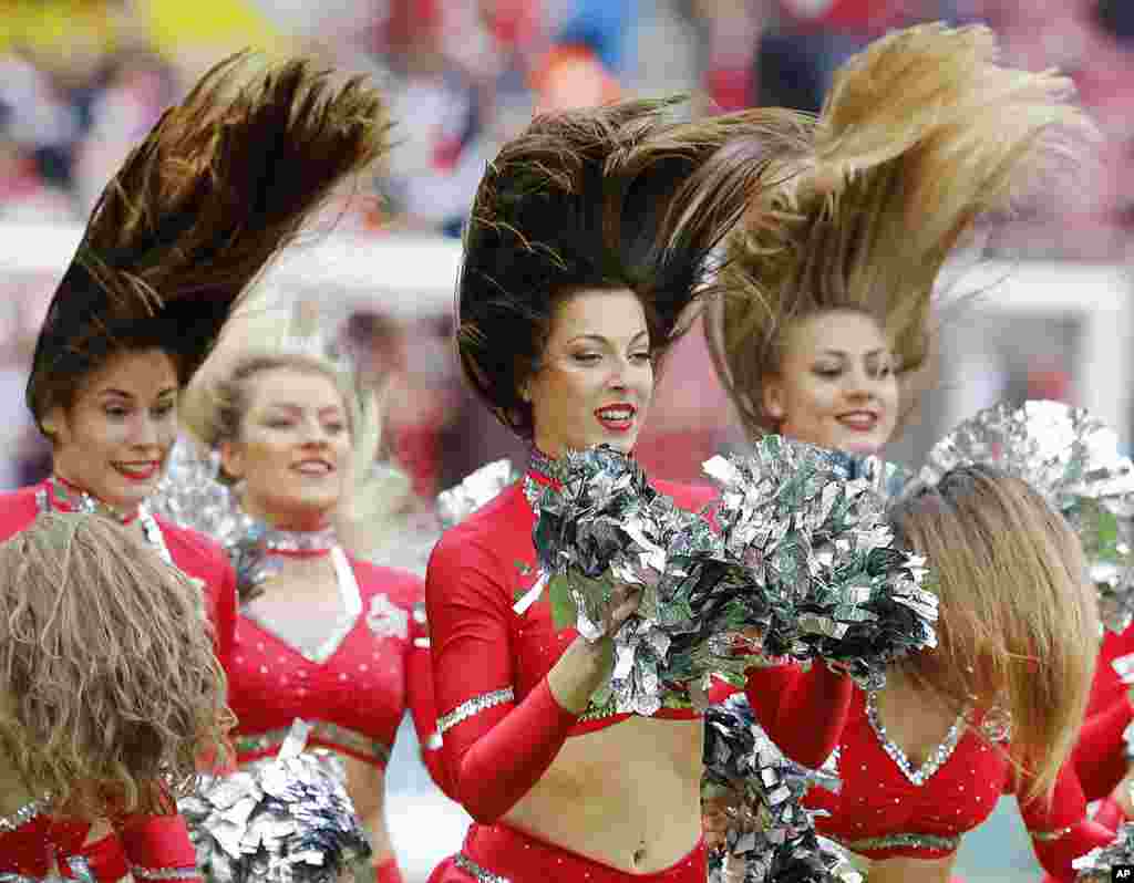 Cheerleaders perform prior to a German first division Bundesliga soccer match between 1. FC Cologne and Bayern Munich in Cologne, March 4, 2017.