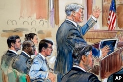 This sketch depicts defense lawyer Kevin Downing asking questions of Rick Gates, as former Trump campaign chairman Paul Manafort, bottom right, listens during Manafort's trial on bank fraud and tax evasion, Aug. 7, 2018.