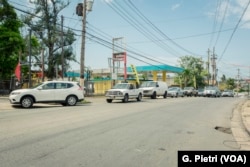 Cars line up at gas stations across Puerto Rico to fill up their tanks after an islandwide blackout leaves the entire island without electricity, Guaynabo, Puerto Rico, April 18, 2018.