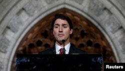 FILE - Canada's Prime Minister Justin Trudeau, shown participating in a news conference in Ottawa last month, stressed the importance of U.S.-Canada ties in a video address to the new Congress in Washington. 