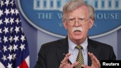 U.S. National Security Adviser John Bolton answers questions from reporters after announcing that the U.S. will withdraw from the Vienna protocol and the 1955 "Treaty of Amity" with Iran in the White House briefing room in Washington, Oct. 3, 2018.