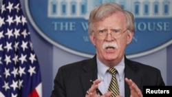 FILE - U.S. National Security Adviser John Bolton answers questions from reporters in the White House briefing room in Washington, Oct. 3, 2018.