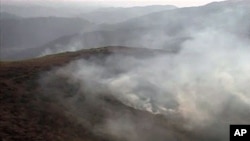 An image taken from an Inter Services Public Relations video shows smoke billowing from army posts after a NATO attack in the Pakistan-Afghanistan border area, November 30, 2011