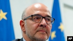 European Commissioner for Economic and Financial Affairs Pierre Moscovici talks to the media during a press conference, in Rome, Oct. 19, 2018.