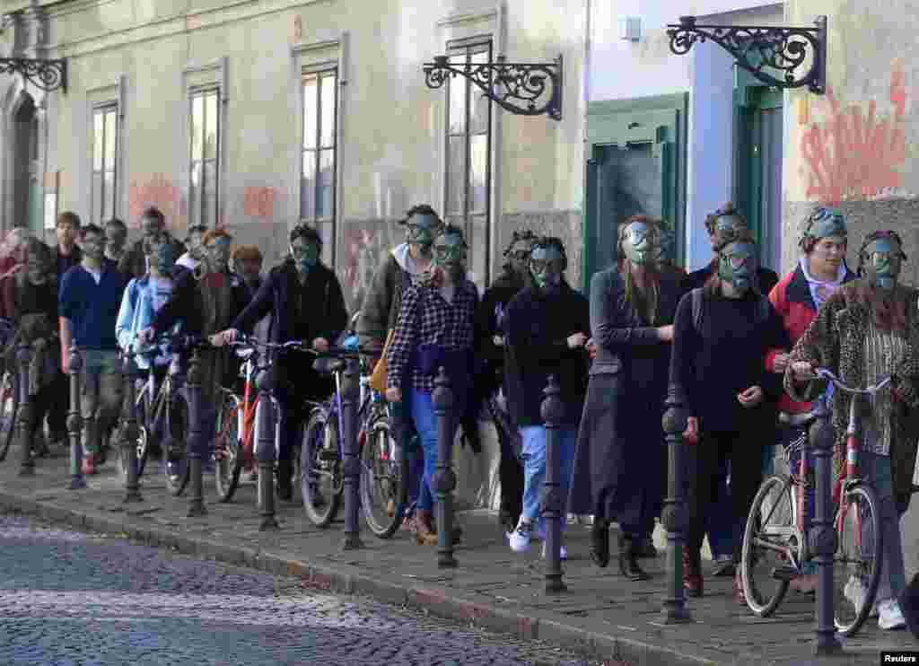 Activists from the Youth for Climate Justice movement protest during the last Valentine&#39;s Day performance against the national energy and climate plan in Ljubljana, Slovenia.