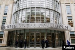FILE - Police guard the courthouse of United States District Court for the Eastern District of New York where Joaquin "El Chapo" Guzman was brought, in Brooklyn, New York, Nov. 5, 2018.