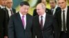 Russian President Vladimir Putin, right, and Chinese President Xi Jinping enter a hall for the talks in the Kremlin in Moscow, Russia, June 5, 2019. 