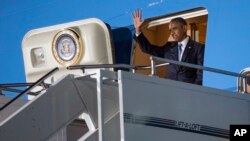 President Barack Obama waves as he arrives at Kenyatta International Airport, on Friday, July 24, 2015, in Nairobi, Kenya. Obama is traveling on a two-nation African tour where he will become the the first sitting U.S. president to visit Kenya and Ethiopia. (AP Photo/Evan Vucci)