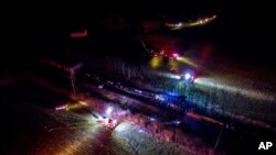 This photo provided by Nicholas Waun shows the scene where two trains collided and derailed in Georgetown, Ky., early Monday, March 19, 2018. 