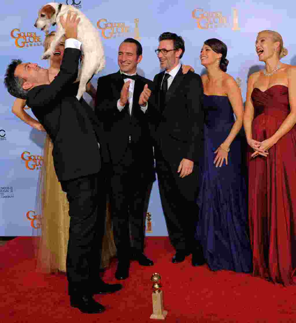 The cast and crew of "The Artist," a big winner at the January 15, 2012 awards ceremony. The film won best musical or comedy, best actor in a musical or comedy for Jean Dujardin, and best original score. (AP)