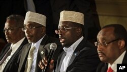Somali President Sheikh Sharif Ahmed, center-right, speaks to reporters in Nairobi, Kenya, Friday. Somalia's political leaders agreed on a draft constitution. 