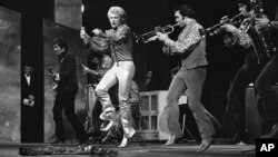 FILE - In this Dec. 16 1967 French rock singer Johnny Hallyday performs at the Palais de Chaillot in Paris.