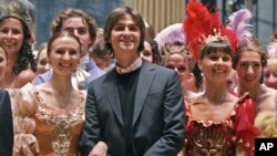 Sergei Filin (C) poses with members of the Bolshoi Theater company involved in the Sleeping Beauty ballet, after a rehearsal, in the Bolshoi Theater that underwent renovation, in Moscow, Russia, September 20, 2011.