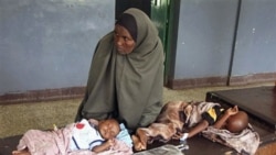 Malnourished children from southern Somalia on a bed at Bandar hospital in Mogadishu