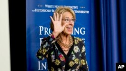 U.S. Education Secretary Betsy DeVos waves as she steps away from the podium after speaking at the White House, in Washington, Sept. 18, 2017.