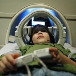 A 9-year-old boy with dyslexia in an MRI machine in 2004. Scientists now want to know whether brain images can identify younger children who might develop future reading problems.