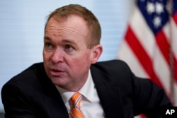 FILE - Budget Director Mick Mulvaney speaks during a meeting in the Eisenhower Executive Office Building on the White House complex in Washington, May 25, 2017.