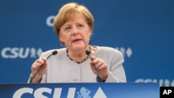 German Chancellor Angela Merkel delivers a speech during a joint campaigning event of the Christian Democratic Union (CDU) and the Christion Social Union (CSU) in Munich, May 27, 2017. 