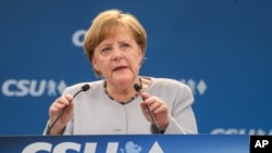 German Chancellor Angela Merkel delivers a speech during a joint campaigning event of the Christian Democratic Union (CDU) and the Christion Social Union (CSU) in Munich, May 27, 2017.
