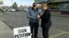 Marie Christopherson of Buhl, Idaho, stopped to sign Rick Martin's petition to ban refugee centers in Twin Falls County.