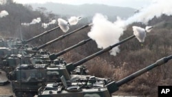 South Korean Army's K-9 self-propelled gun fire live rounds during the largest joint air and ground military exercises on the Seungjin Fire Training Field in mountainous Pocheon, 20 miles (30 kilometers) from the Koreas' heavily fortified border, South Ko