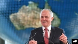 FILE - Australian Prime Minister Malcolm Turnbull delivers a speech in Tokyo, Japan. Turnbull, a former online entrepreneur, said hacking costs his country around $780 million per year.