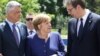 From left, President Hashim Thaci, German Chancellor Angela Merkel and Serbian President Aleksandar Vucic speak prior to the family photo during an EU-Western Balkans Summit in Sofia, May 17, 2018. 