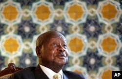 FILE - Ugandan President Yoweri Museveni speaks to reporters at the Akasaka Palace state guesthouse in Tokyo, Sept. 12, 2015.