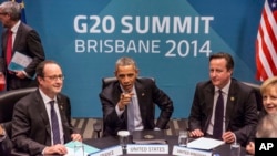 FILE - President of France Francois Hollande, U.S. President Barack Obama, Britain's Prime Minister David Cameron and Germany's Chancellor Angela Merkel attend the Transatlantic Trade and Investment Partnership (TTIP) meeting at the G-20 leaders summit. 