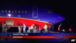 This frame grab provided by KSPR-TV shows a Southwest Airlines flight that was scheduled to arrive Jan. 12, 2014, at Branson Airport in southwest Missouri instead landed at an airport 7 miles north. 